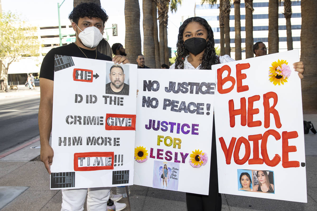 Brian Batres, left, and his girlfriend Ana Gonzalez participate in a protest to call for justic ...