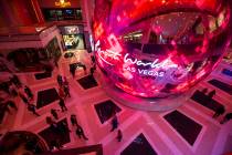 People walk around The District during the opening night of Resorts World Las Vegas on Thursday ...