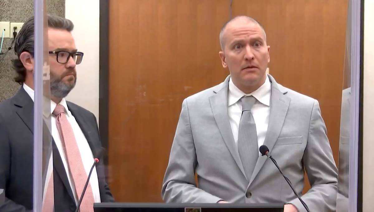 In this image taken from video, former Minneapolis police Officer Derek Chauvin, right, accompa ...