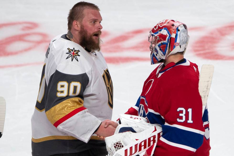 Vegas Golden Knights goaltender Robin Lehner (90) congratulates Montreal Canadiens goaltender C ...