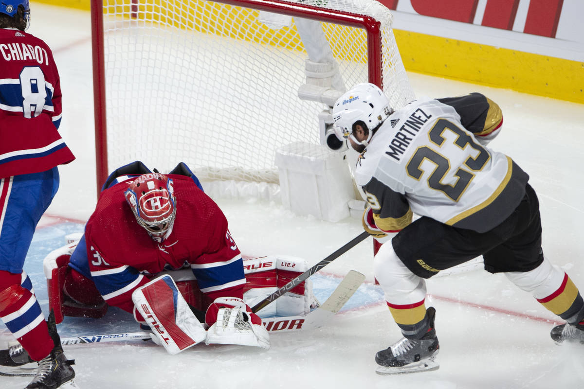 Vegas Golden Knights' Alec Martinez (23) scores on Montreal Canadiens goaltender Carey Price (3 ...