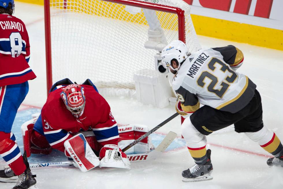 Vegas Golden Knights' Alec Martinez (23) scores on Montreal Canadiens goaltender Carey Price (3 ...