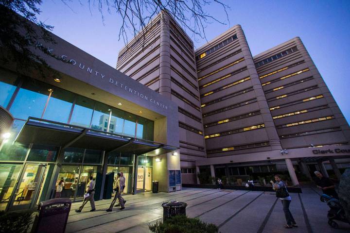 People walk outside of the Clark County Detention Center in downtown Las Vegas. (Chase Stevens/ ...