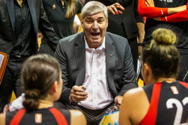 Las Vegas Aces head coach Bill Laimbeer talks up his players in a huddle during a timeout as th ...