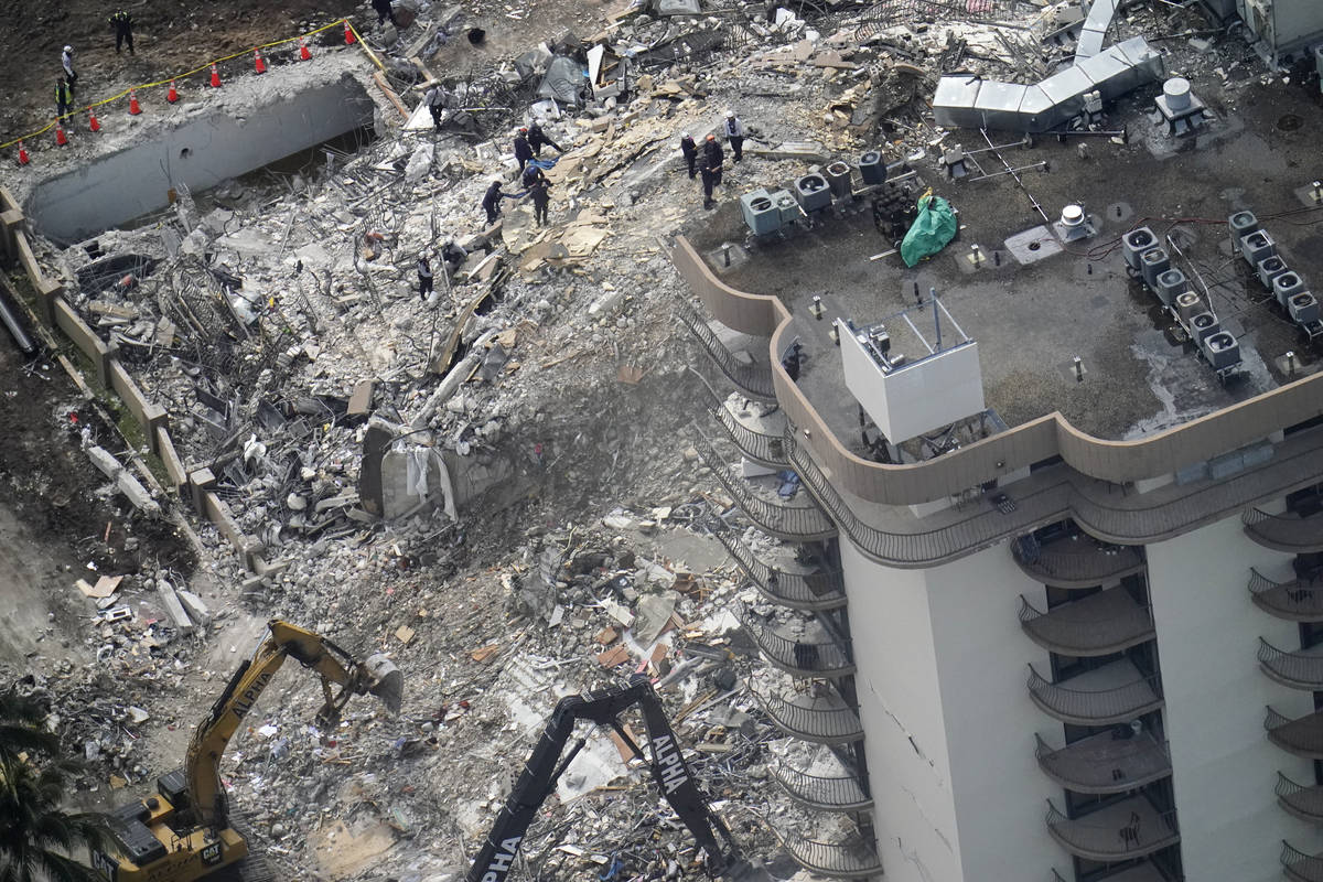 Rescue workers search in the rubble at the Champlain Towers South Condo, Saturday, June 26, 202 ...