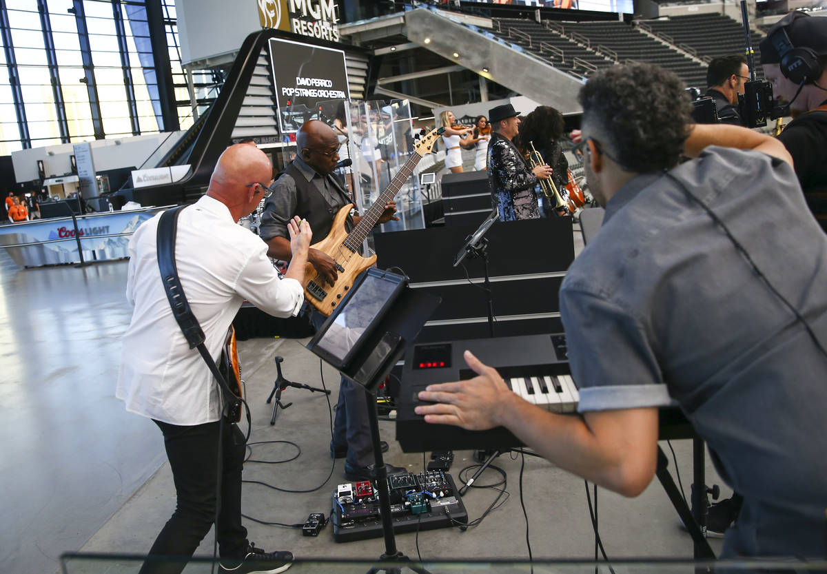 Members of David Perrico's Pop Strings band perform at Allegiant Stadium in Las Vegas on Monday ...