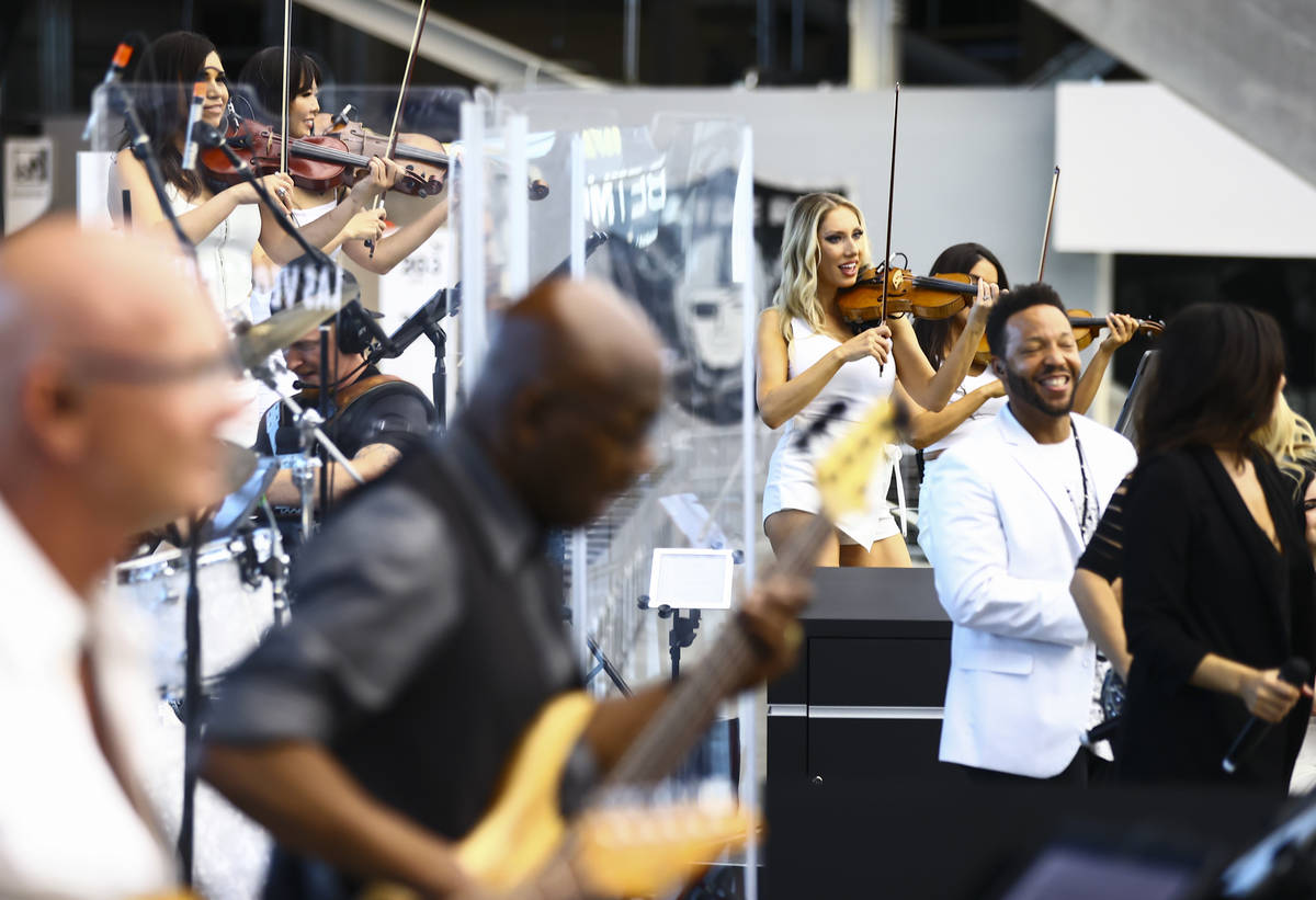 Members of David Perrico's Pop Strings band perform at Allegiant Stadium in Las Vegas on Monday ...