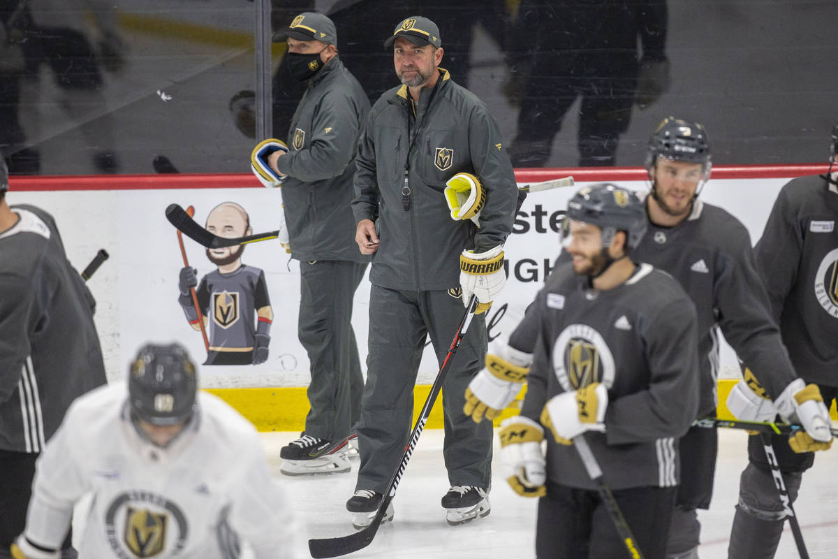 Vegas Golden Knights head coach Pete DeBoer looks on as the team disperses from a meeting on th ...
