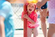 Raegan Sack, 4, cools off at Max Patterson Park during a record setting heat wave in Gladstone, ...