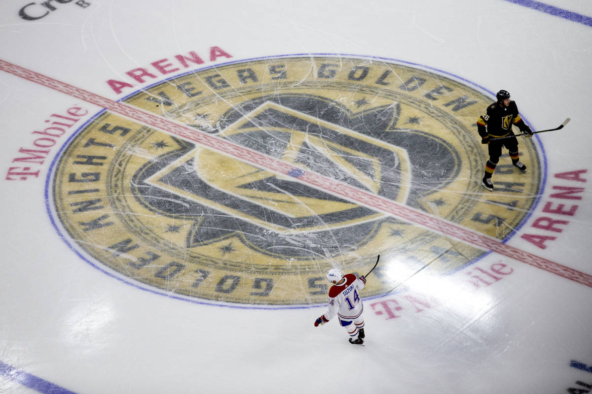 Golden Knights center Mattias Janmark (26) and Canadiens center Nick Suzuki (14) skate during w ...