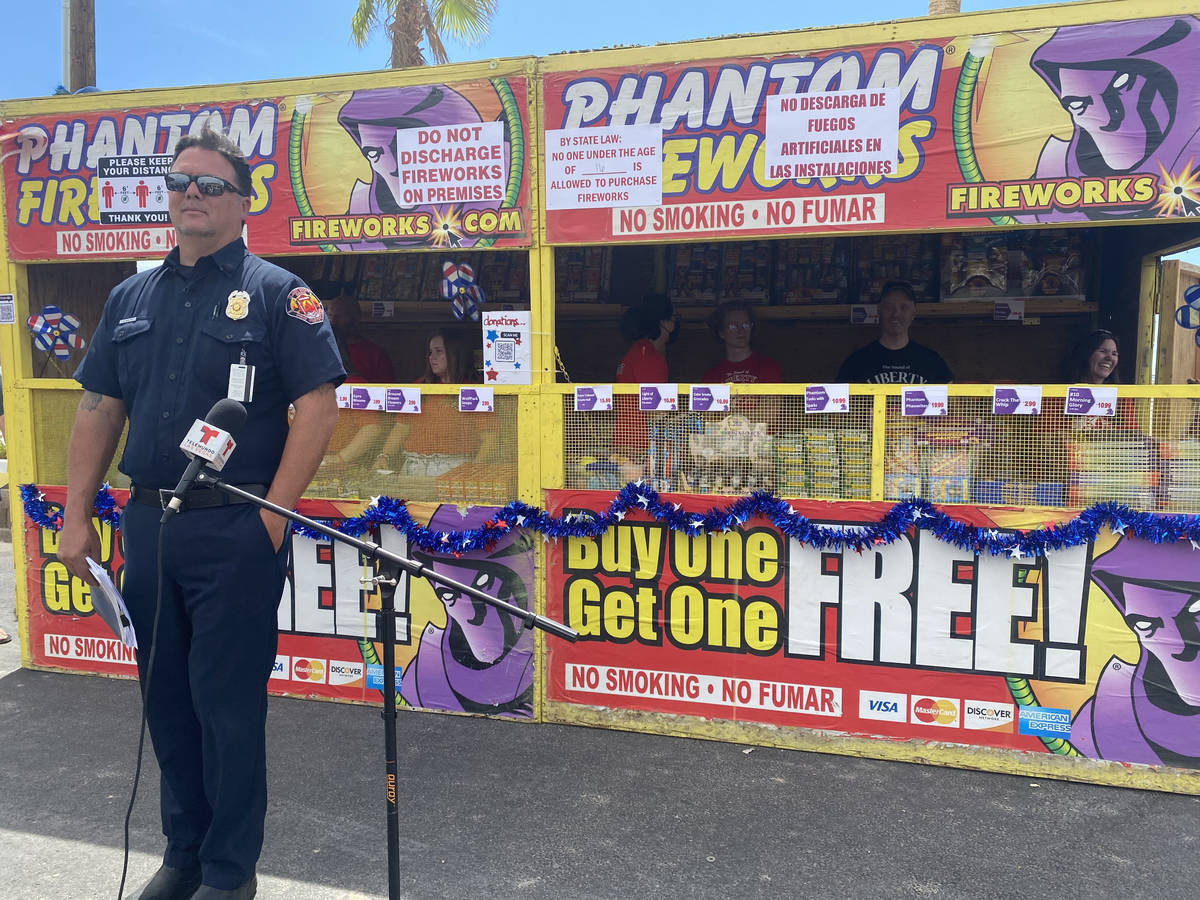 Clark County Fire Inspector Nick Giolito stands in front of a fireworks booth on Monday in the ...