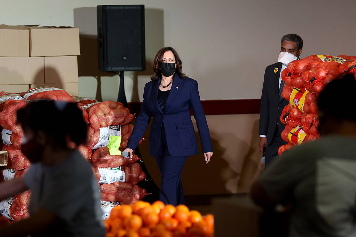 Vice President Kamala Harris arrives with U.S. Rep. Steven Horsford, D-Nev., to tout the recent ...