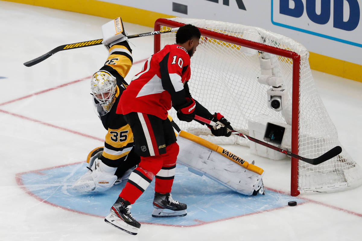 Pittsburgh Penguins goalie Triastn Jarry stops a Ottawa Senators' Anthony Duclair shot during t ...
