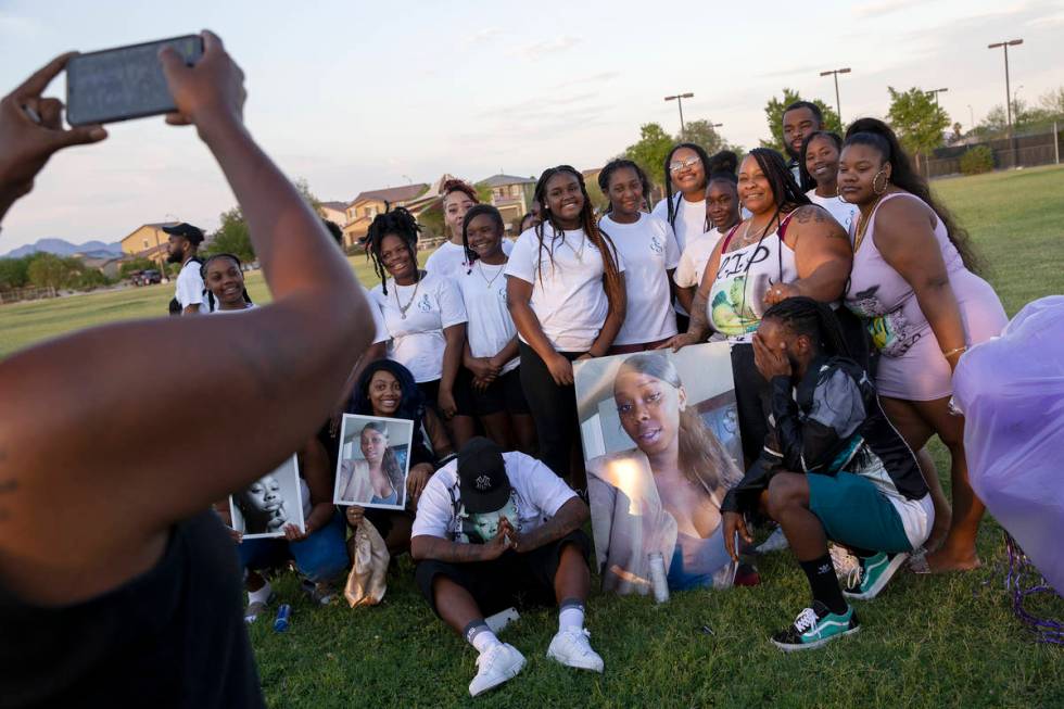 Loved ones of 18-year-old Shania James, who was shot and killed in Las Vegas last week, pose fo ...