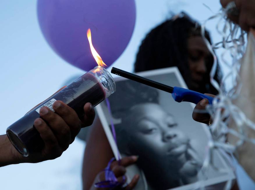 Candles are lit at a vigil for 18-year-old Shania James, who was shot and killed in Las Vegas l ...