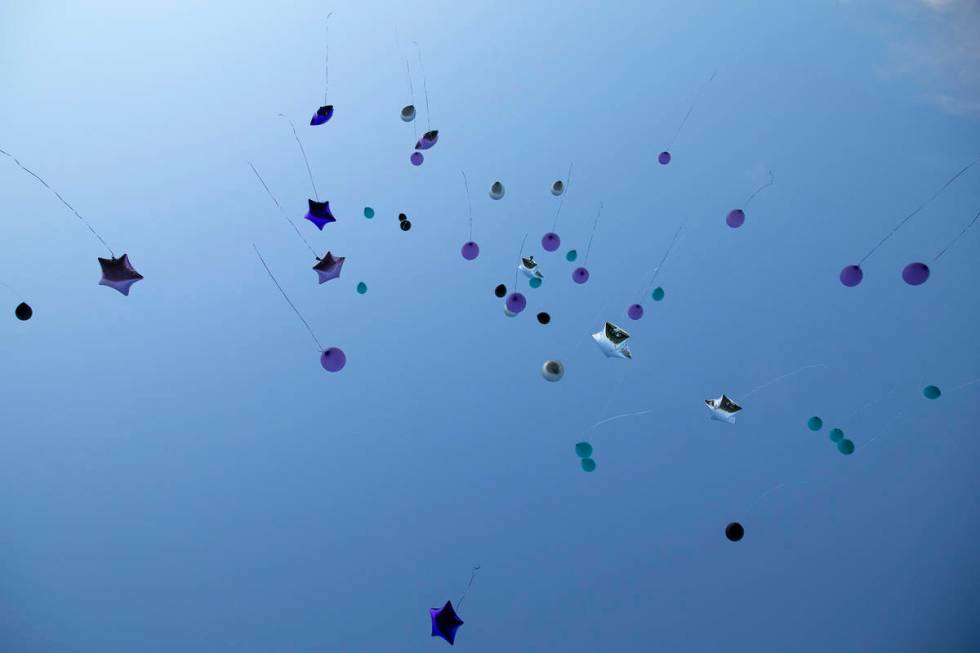 Balloons are released into the sky in honor of 18-year-old Shania James, who was shot and kille ...