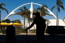 A traveler awaits for transportation at the Los Angeles International Airport in Los Angeles in ...