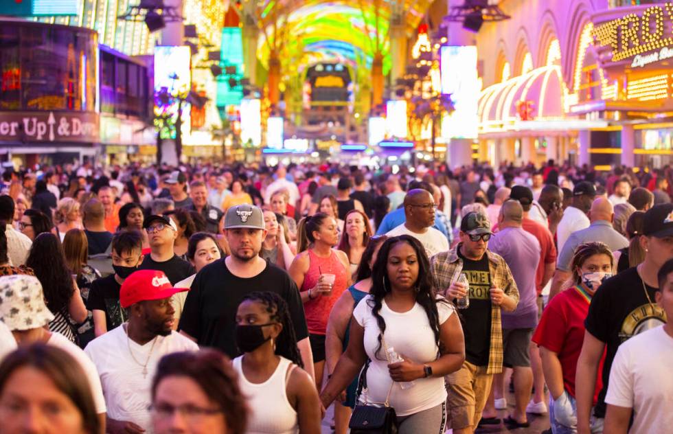 Visitors take in the sites at the Fremont Street Experience during Memorial Day weekend on Satu ...
