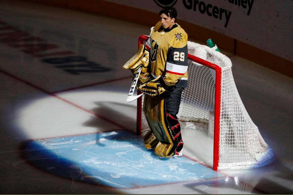 Golden Knights goaltender Marc-Andre Fleury (29) pauses during the National Anthem before the f ...