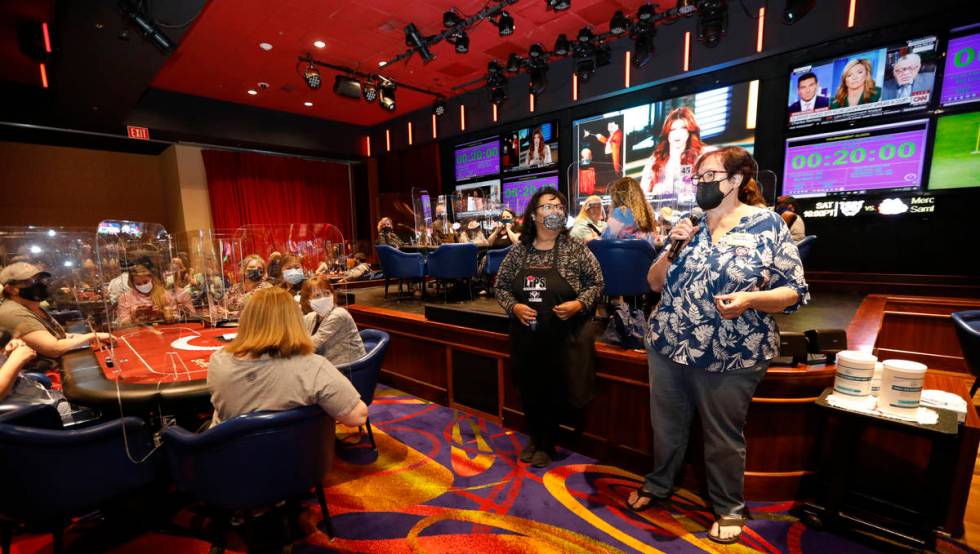 Linda Johnson, co-host of 2021 Nevada State Ladies Poker Championship, right, speaks before $17 ...