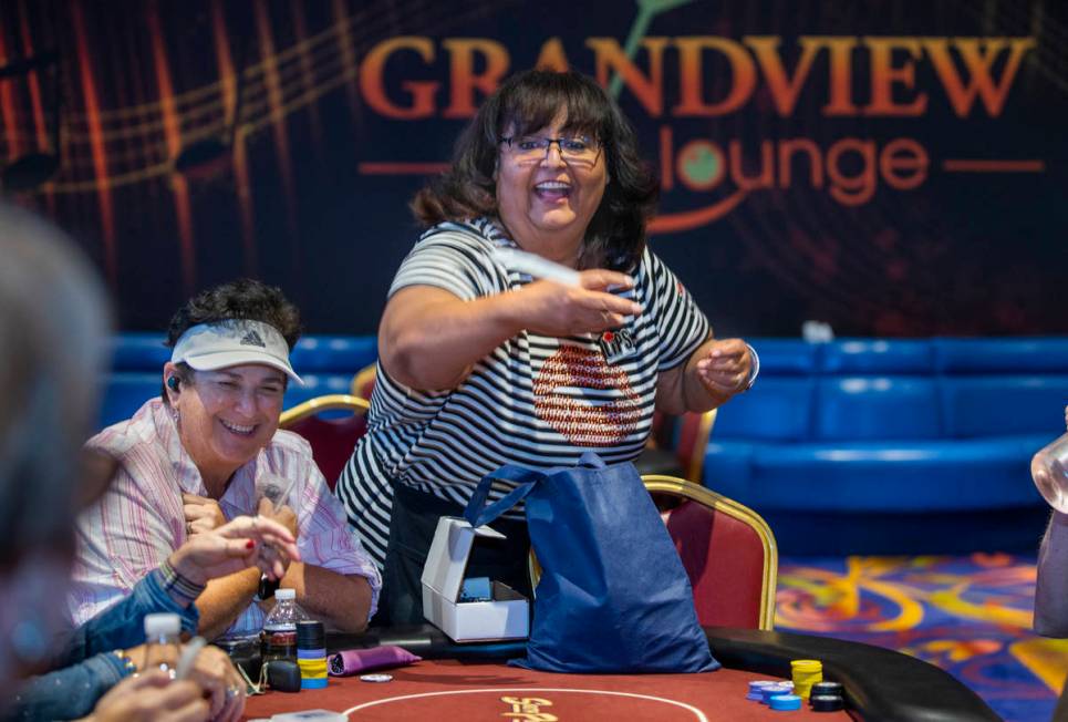 Ladies International Poker Series (LIPS) founder Lupe Soto tosses free merchandise to players d ...