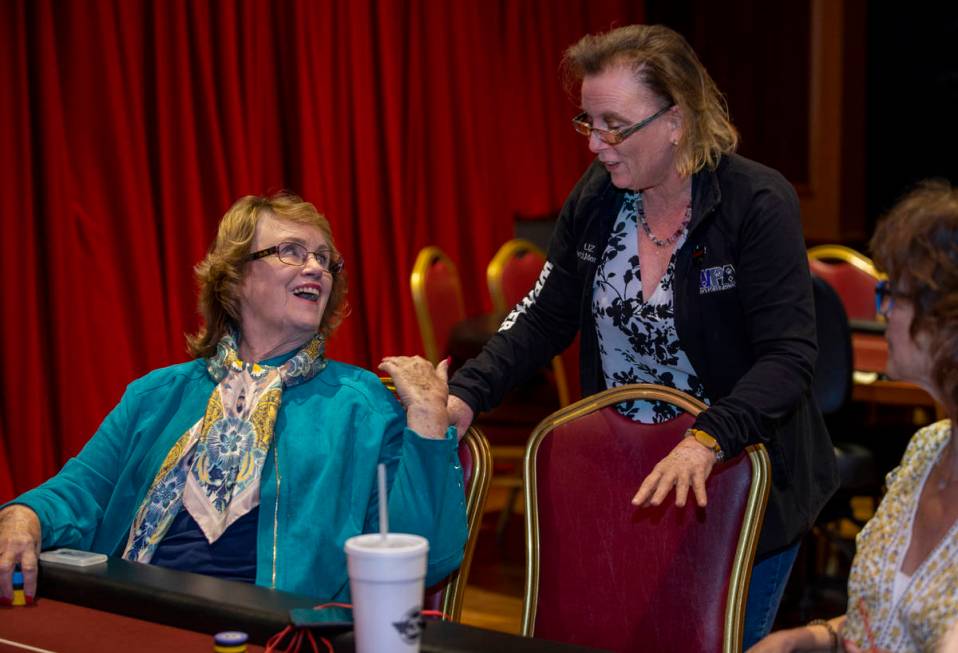 Players Patty Pfeil, left, and Liz Huey talk in between hands as they compete in the $350 buy-i ...
