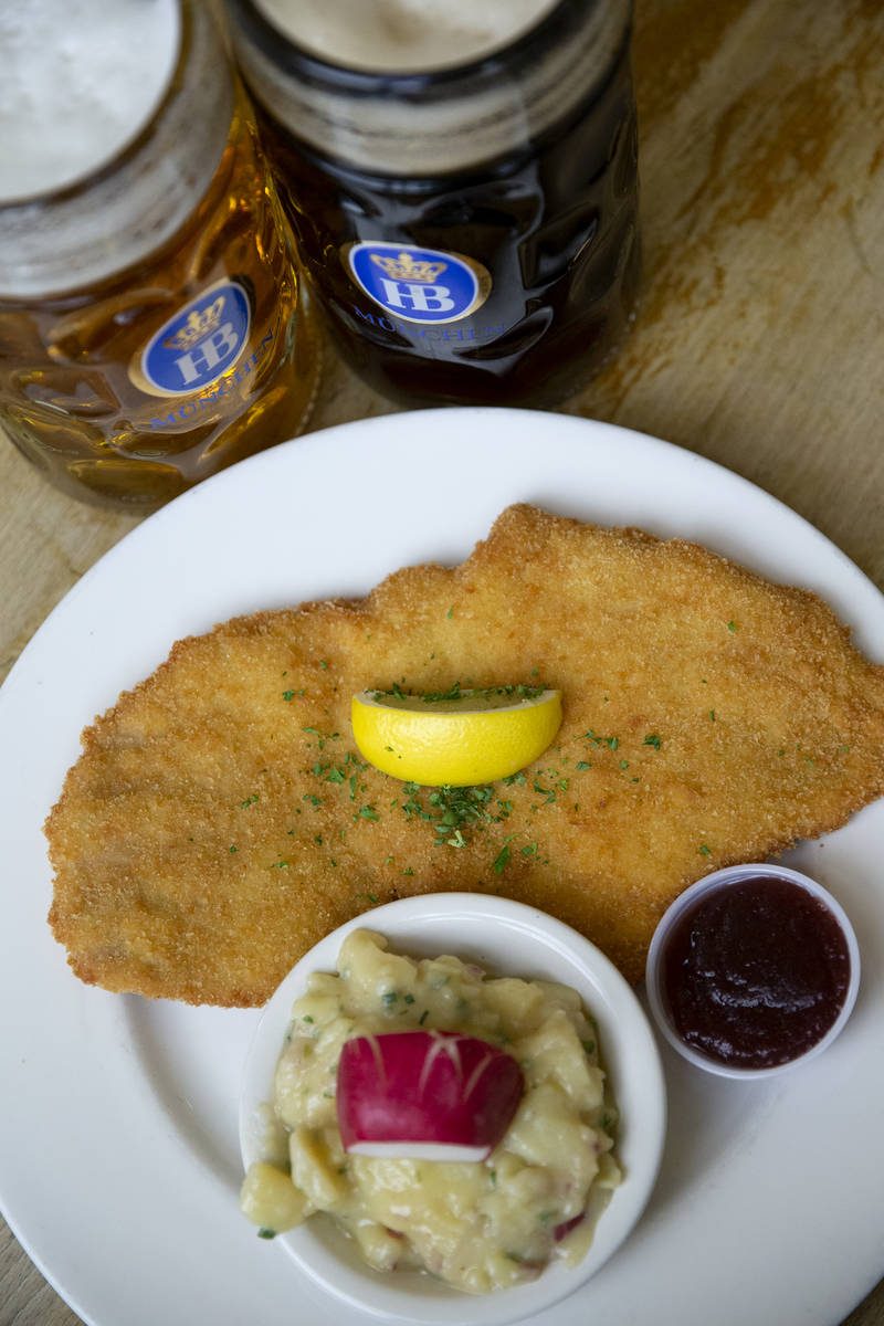 The "Schnitzel Wiener Art" and two German beers are displayed at Hofbrauhaus on Thurs ...