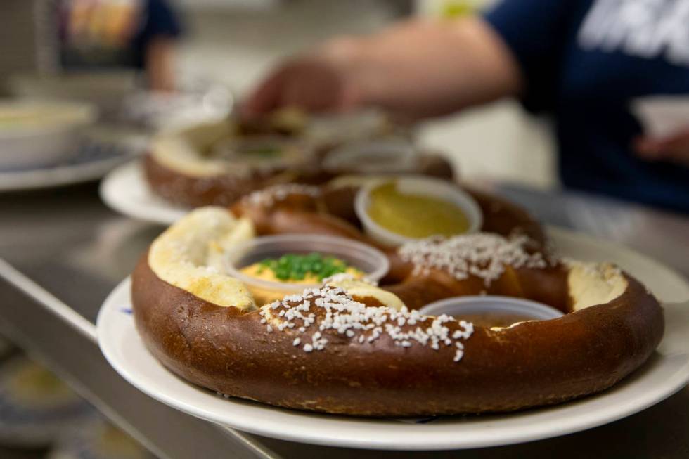 The "Riesenbrezen Combo," a giant pretzel served with Obatzda cheese, sweet mustard a ...