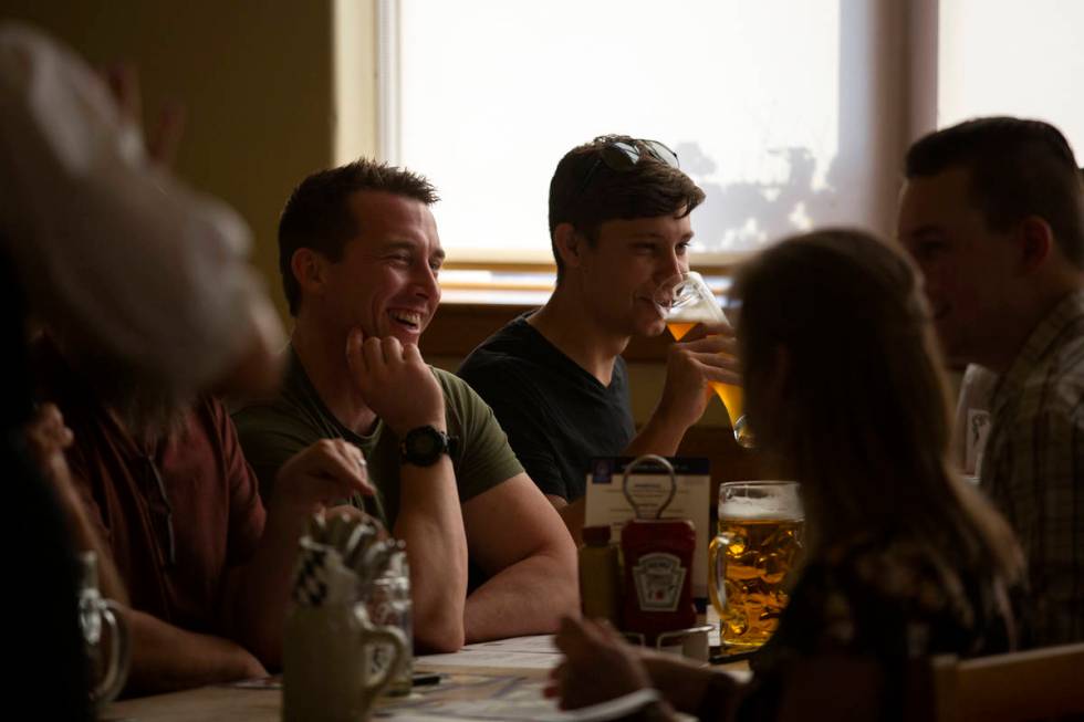 Diners enjoy their beers before ordering traditional German cuisine at Hofbrauhaus on Thursday, ...