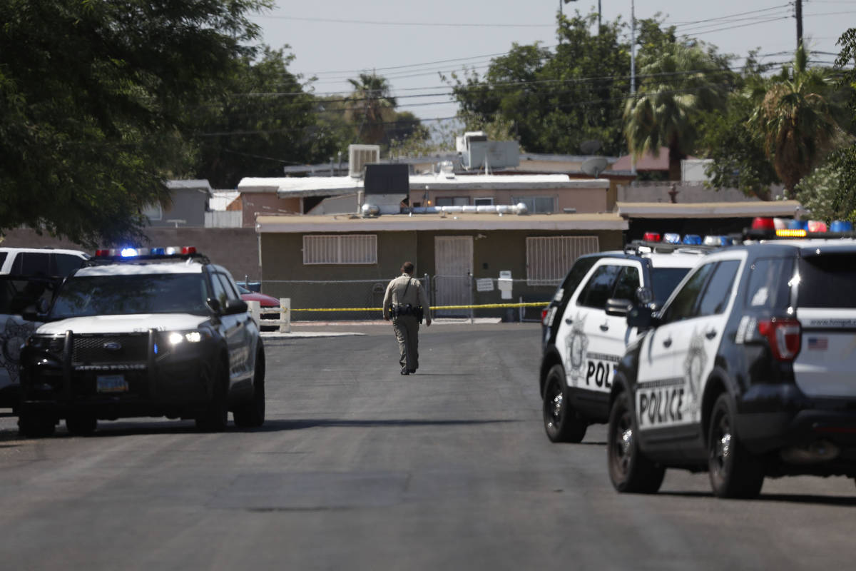 Las Vegas police investigate around Euclid Avenue near Oakey Boulevard after a man was shot and ...
