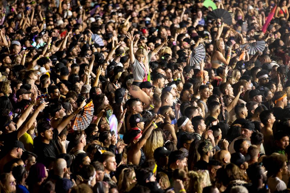 People dance to Excision performing at the Downtown Las Vegas Events Center in Las Vegas, Satur ...