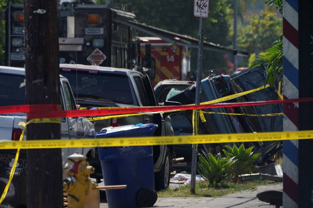 The remains of flipped vehicle is seen Thursday, July 1, 2021, after an armored Los Angeles Pol ...