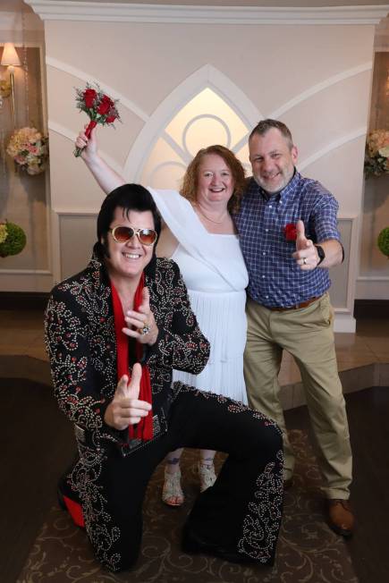 New Yorkers Cindy and Don Couse celebrate, along with chapel co-owner and Elvis impersonator Br ...