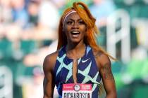 In this June 19, 2021 photo, Sha'Carri Richardson celebrates after winning the first heat of th ...