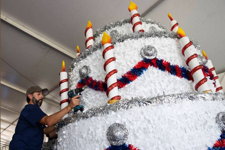 David Bailey, Summerlin Council employee, decorates "Viva Las Vegas" float for the July 4th Sum ...