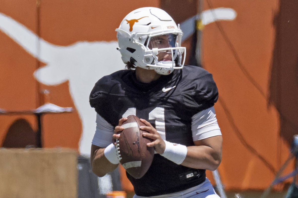Texas quarterback Casey Thompson looks to pass during the final half of the Texas Orange and Wh ...