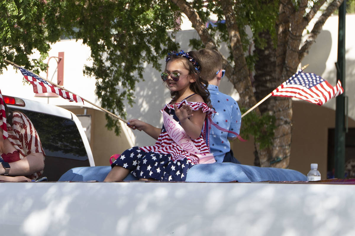 Little Miss Boulder City Emmie Hernandez waves her flag as her truck passes through the two-day ...