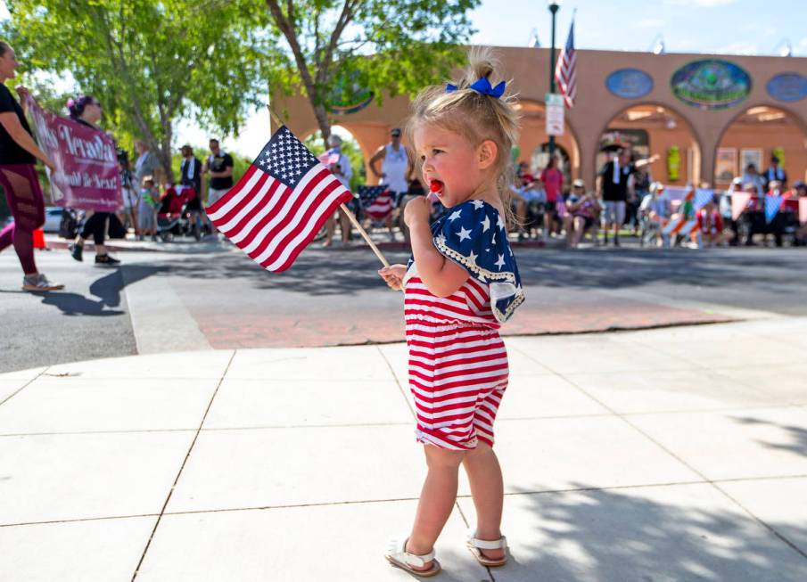 Olivia Ruecking enjoys a treat as the parade passes down Nevada Way during the two-day Damboree ...