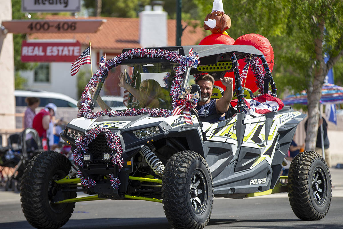 A dune buggy passes through the parade route during the two-day Damboree event on Saturday, Jul ...