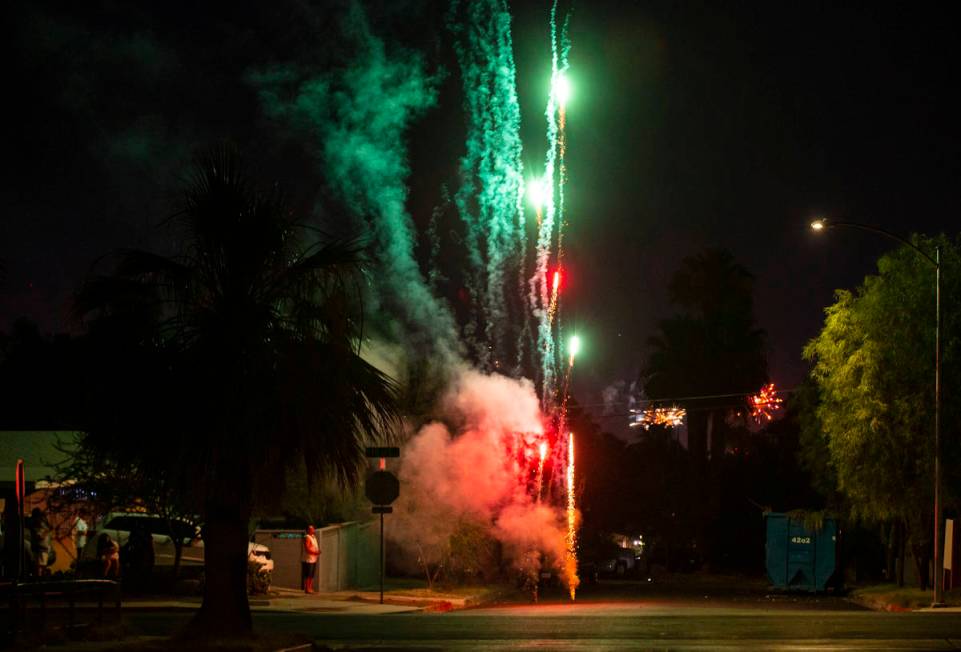 Fireworks go in a neighborhood near downtown Las Vegas in on Sunday, July 4, 2021. (Chase Steve ...