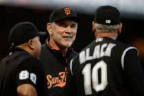FILE - In this Sept. 24, 2019, file photo, San Francisco Giants manager Bruce Bochy, center, sm ...