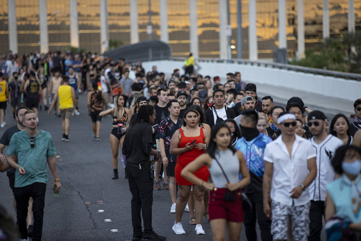 People line up on the Hacienda Avenue bridge to enter Allegiant Stadium in Las Vegas for the Il ...