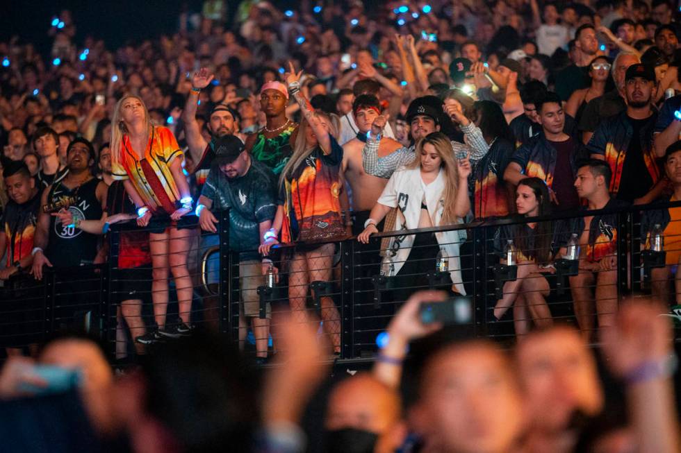 People attend a concert by Illenium at Allegiant Stadium in Las Vegas, Sunday, July 4, 2021. (E ...