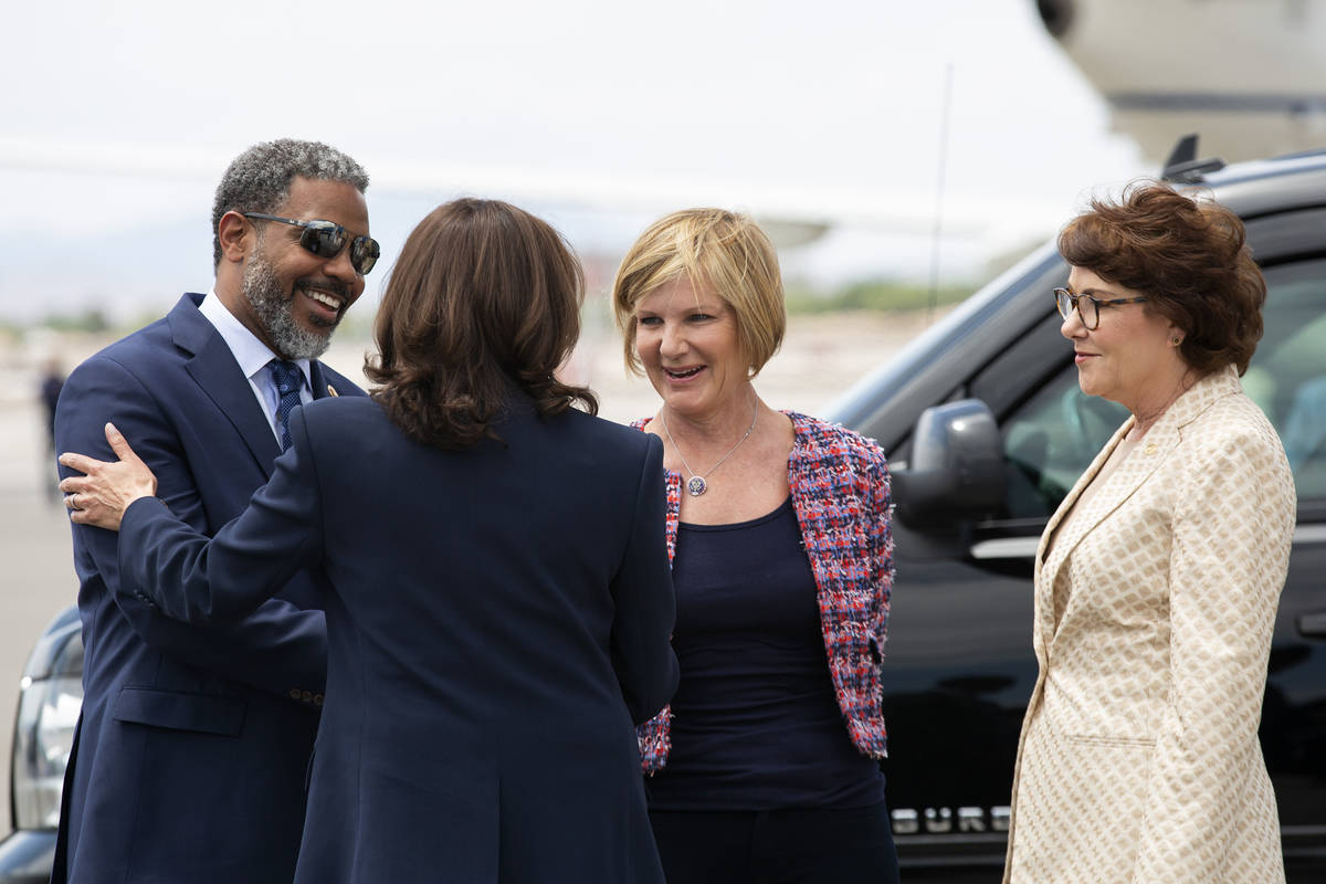 Vice President Kamala Harris is greeted by Rep. Steven Horsford, D-Nev., left, Rep. Susie Lee, ...