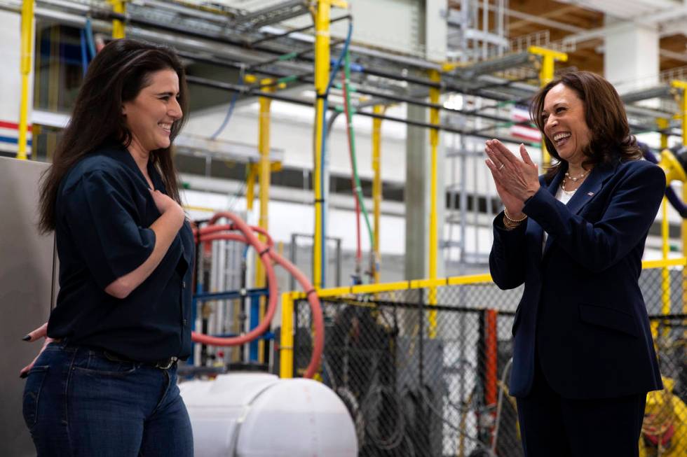 Vice President Kamala Harris, right, applauds the work of Melissa Feoranz, member of United Bro ...