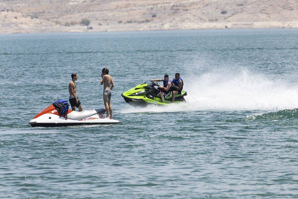 People try to stay cool at Boulder Beach in the Lake Mead National Recreation Area, on Friday, ...