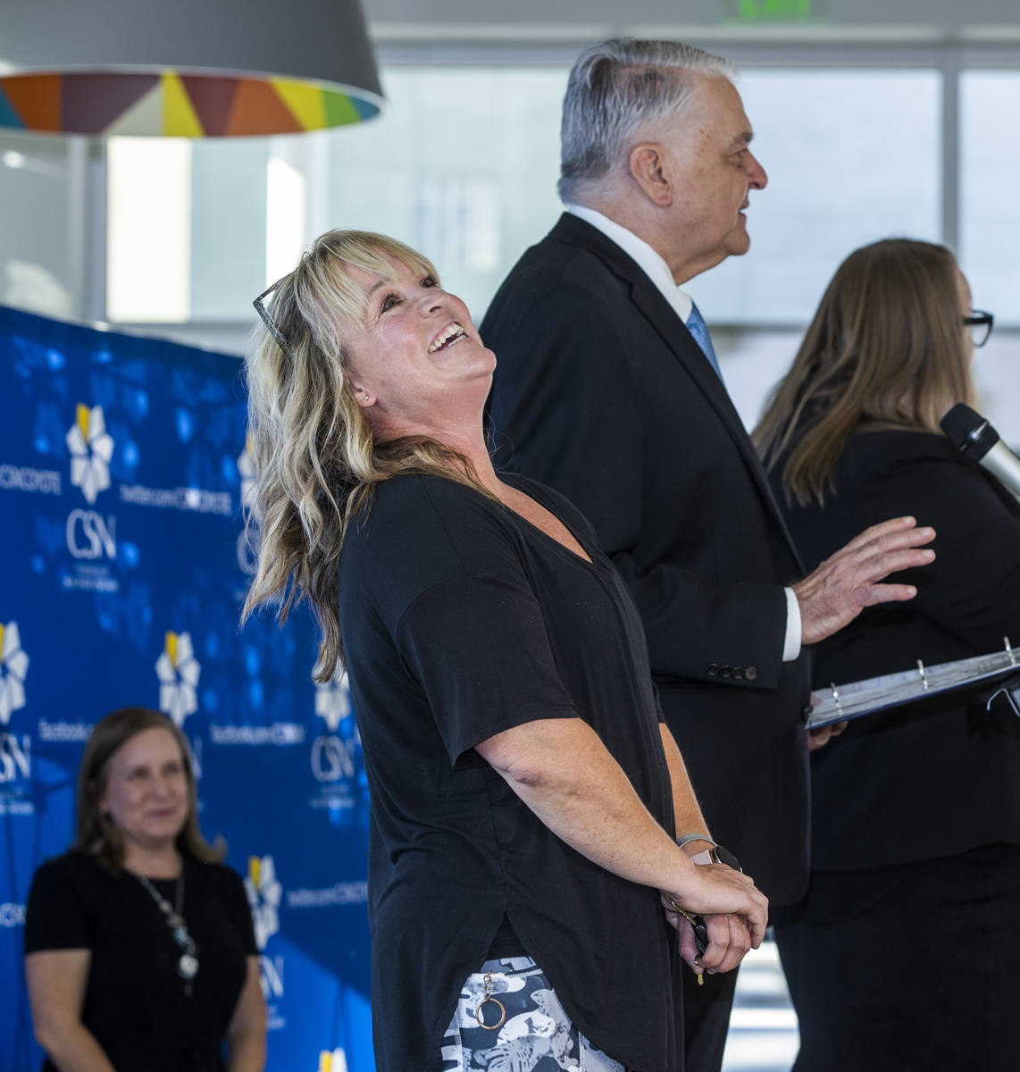 Teacher Elizabeth Allder is surprised after winning $250,000 as Governor Steve Sisolak and Immu ...