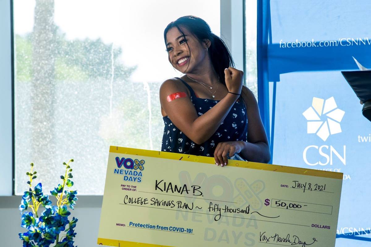 Kiana Butler flexes as she shows off her immunization bandaid after winning $50,000 in a colleg ...