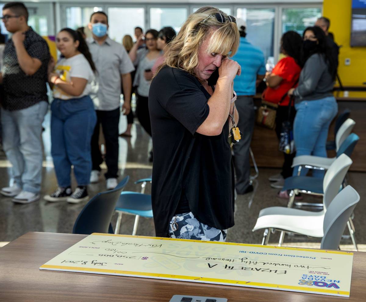 Teacher Elizabeth Allder cries while calling her husband after winning $250,000 as Governor Ste ...