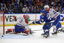 Tampa Bay Lightning left wing Ross Colton (79) scores on Montreal Canadiens goaltender Carey Pr ...
